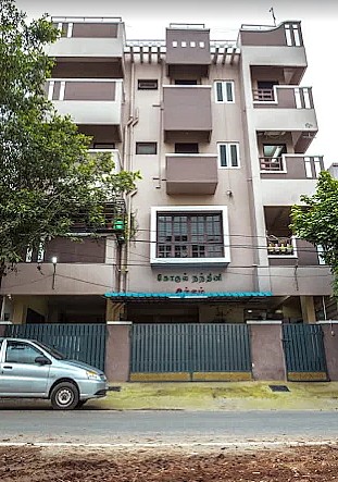 Front view of Gokul Nandhini Service Apartment building in Thudiyalur, Coimbatore
